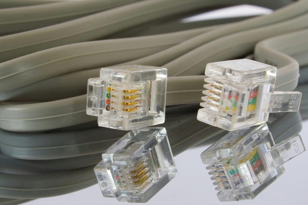 Detailed image of Ethernet cables and connectors, ideal for tech themes.